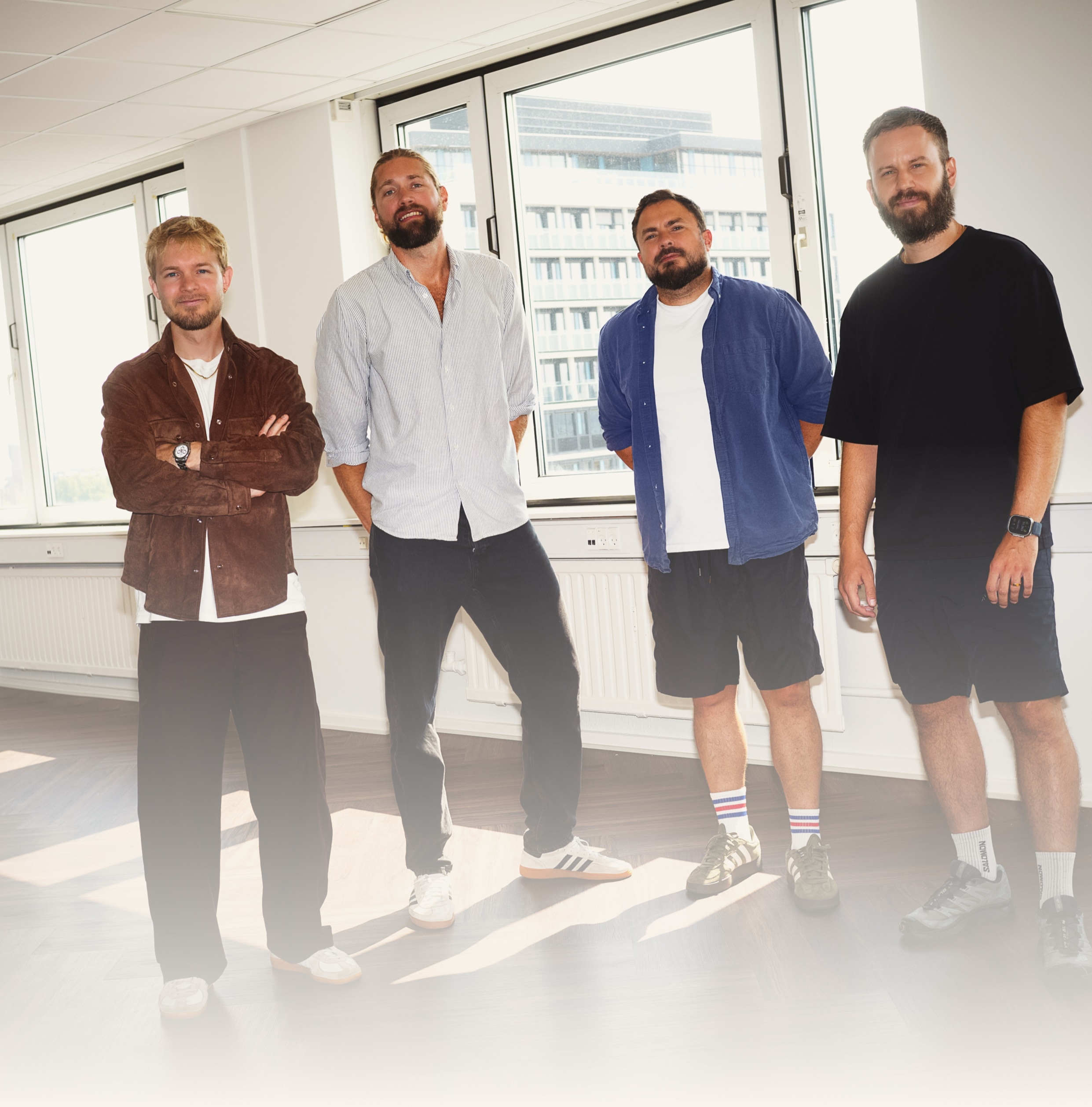 The four Palette founders standing together in the office